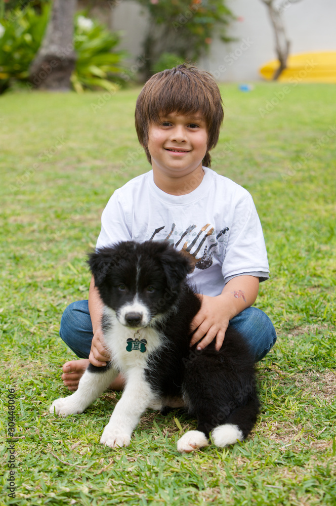 Boy with his Border Collie puppy Boy with his Border Collie puppy