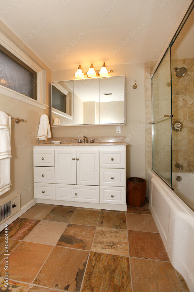 Luxury classic basement bathroom with white and beige Luxury classic basement bathroom with white and beige