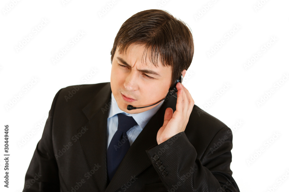 Concentrated businessman with headset isolated on white. Concentrated businessman with headset isolated on white.