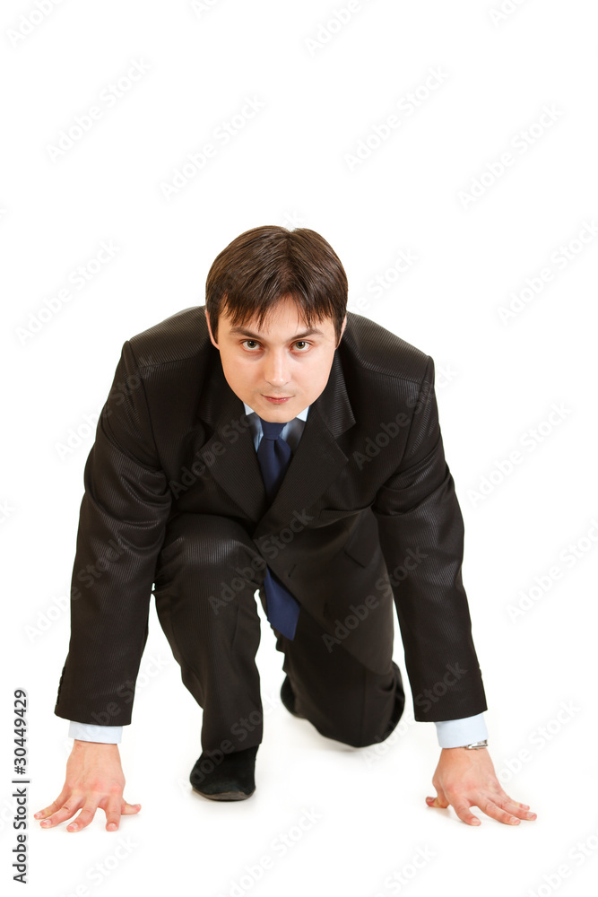 Confident businessmen in start position ready for race Confident businessmen in start position ready for race