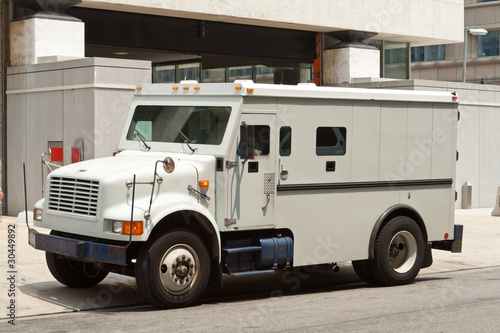 Armoured Armored Car Parked on Street Building photo