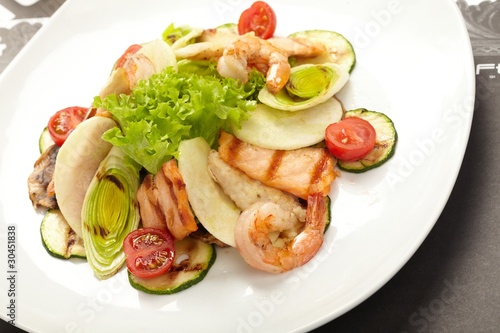 Shrimps with salmon and vegetables