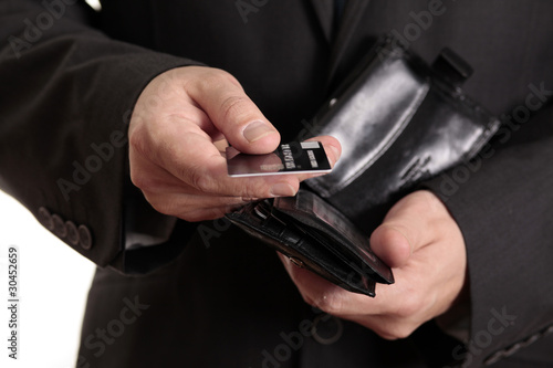 Businessman taking Credit card from Wallet