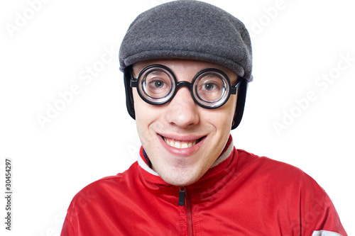 Portrait of a young nerd in funny glasses isolated on white