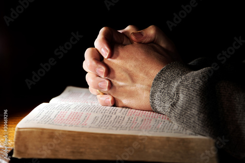Praying Hands with Holy Bible