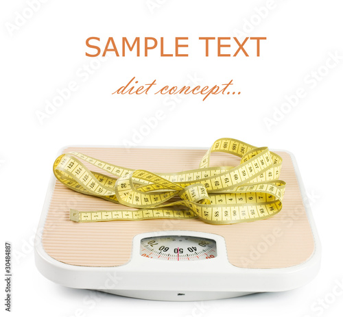 Scale and tape on white background photo