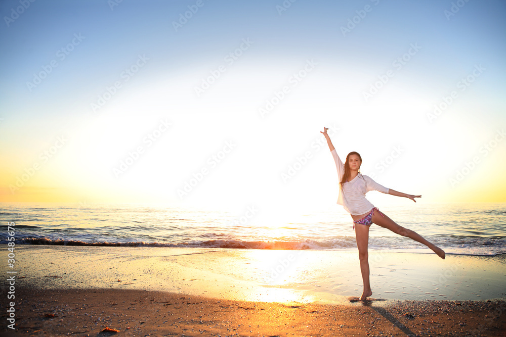 Happy girl enjoys summer day at the beach. Happy girl enjoys summer day at the beach.