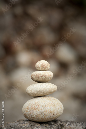 stack of balanced rocks against rocky background