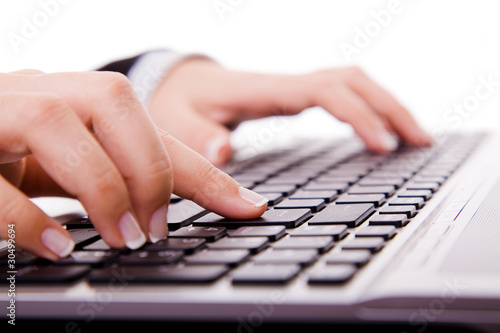 Close-up of secretary   s hand touching computer keys during work