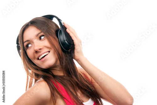 cheerful brunette woman listening and enjoying music