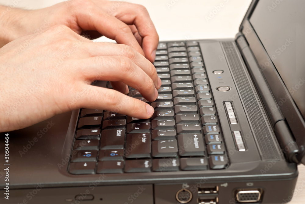Hands on laptop keyboard Hands on laptop keyboard