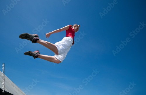 Beautiful woman jump into sky
