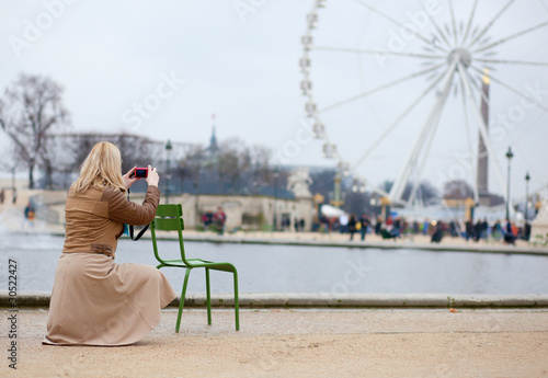 Tourist in Paris making photo