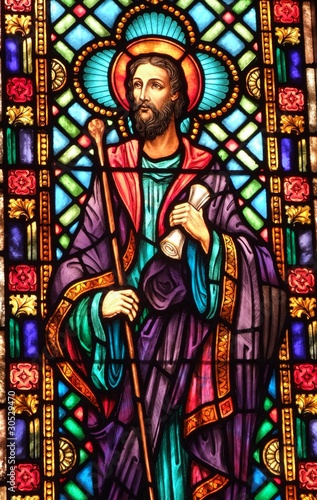 Stained Glass window of Jesus holding a scroll