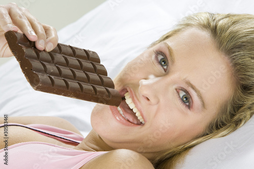 portrait of lying woman with chocolate