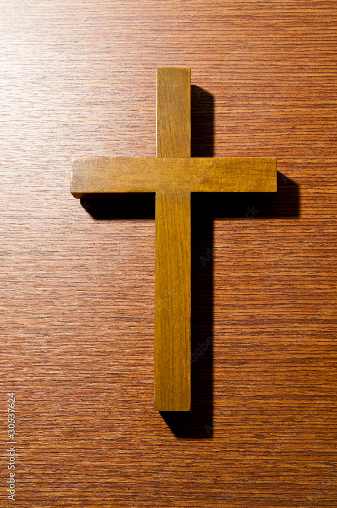 Close up wooden cross on the wall