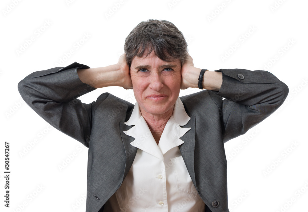 mature businesswoman closing ears with her hands mature businesswoman closing ears with her hands