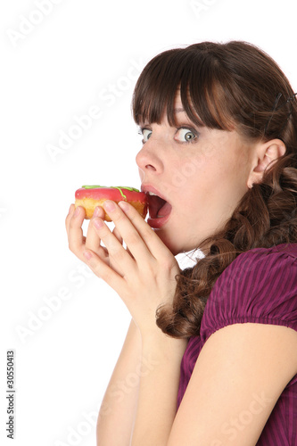 girl eating a donut with caution