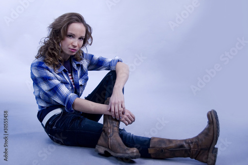 Portrait of beautiful sitting girl. photo