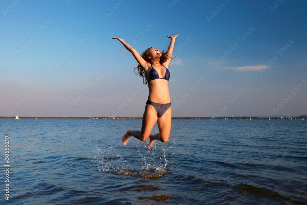 young woman on the sky and water background young woman on the sky and water background