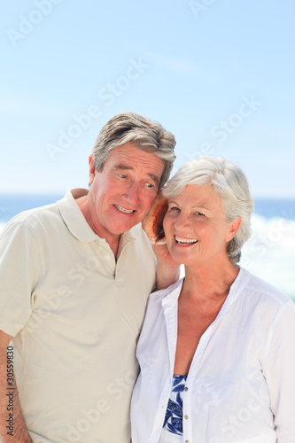 Retired couple listening to their shell