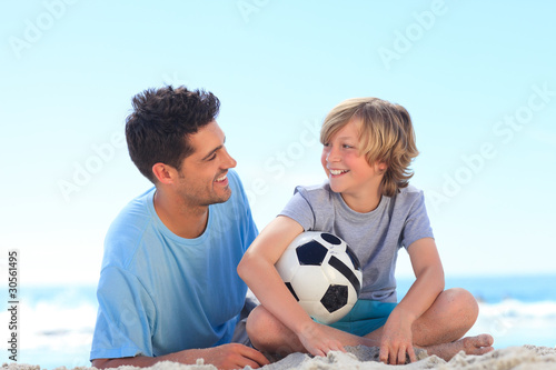 Father and his son with a ball