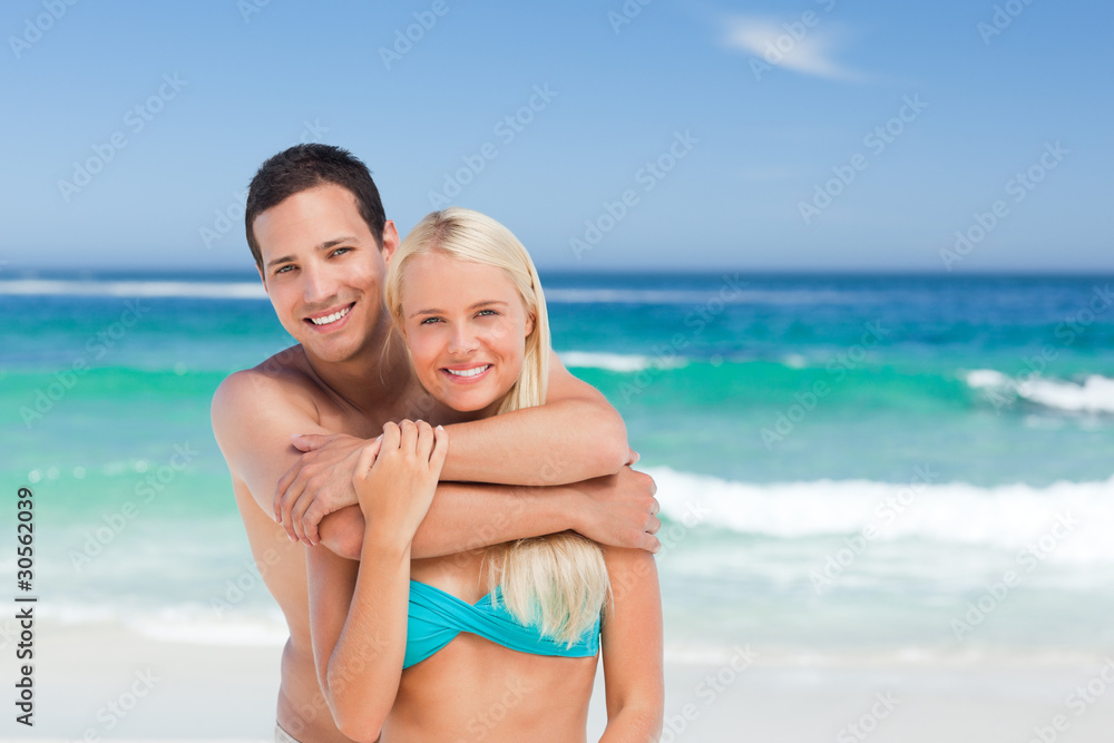 Enamored couple on the beach