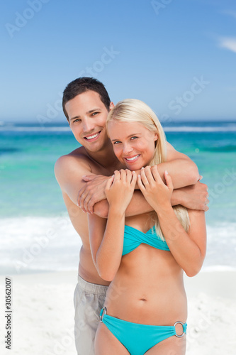 Enamored couple on the beach