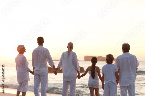 Family at the beach during the sunset