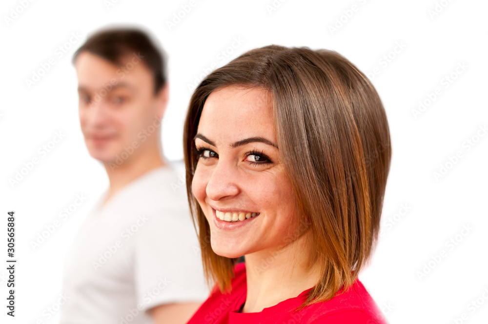 Cute smiling girl face with guy in background. Isolated on white Cute smiling girl face with guy in background. Isolated on white