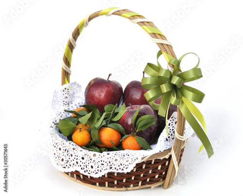 Fruit basket decorated with green ribbon for gift