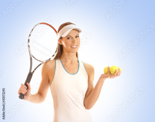 A young and sporty woman with tennis equipment © Acronym