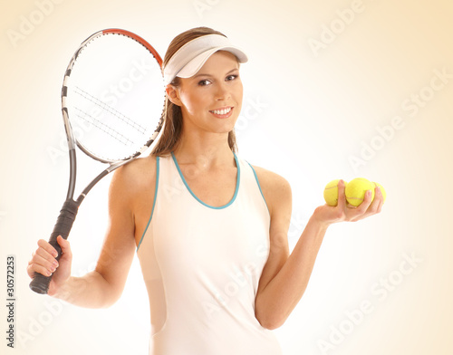 A young and sporty woman with tennis equipment © Maksim Shmeljov