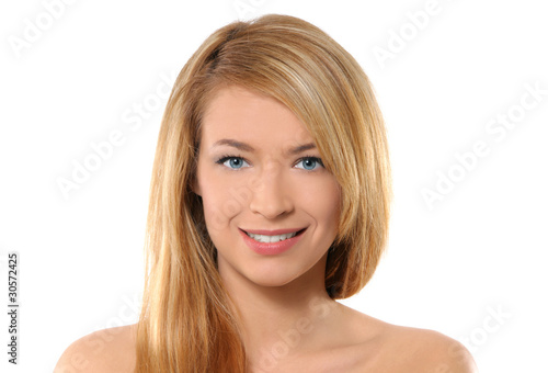 Portrait of a young redhead woman on a white background