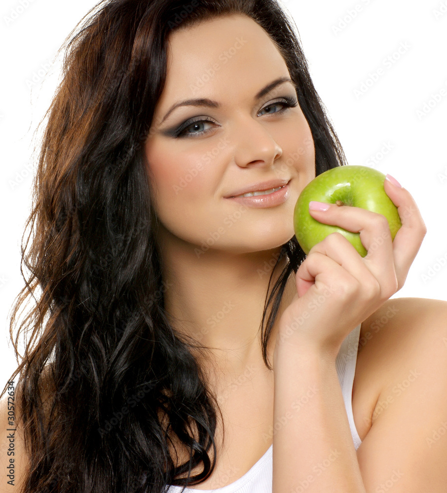 Portrait of a young and attractive woman with a green apple Portrait of a young and attractive woman with a green apple
