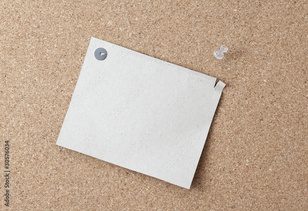 Sheet of paper attached to a pushpin noticeboard. Sheet of paper attached to a pushpin noticeboard.