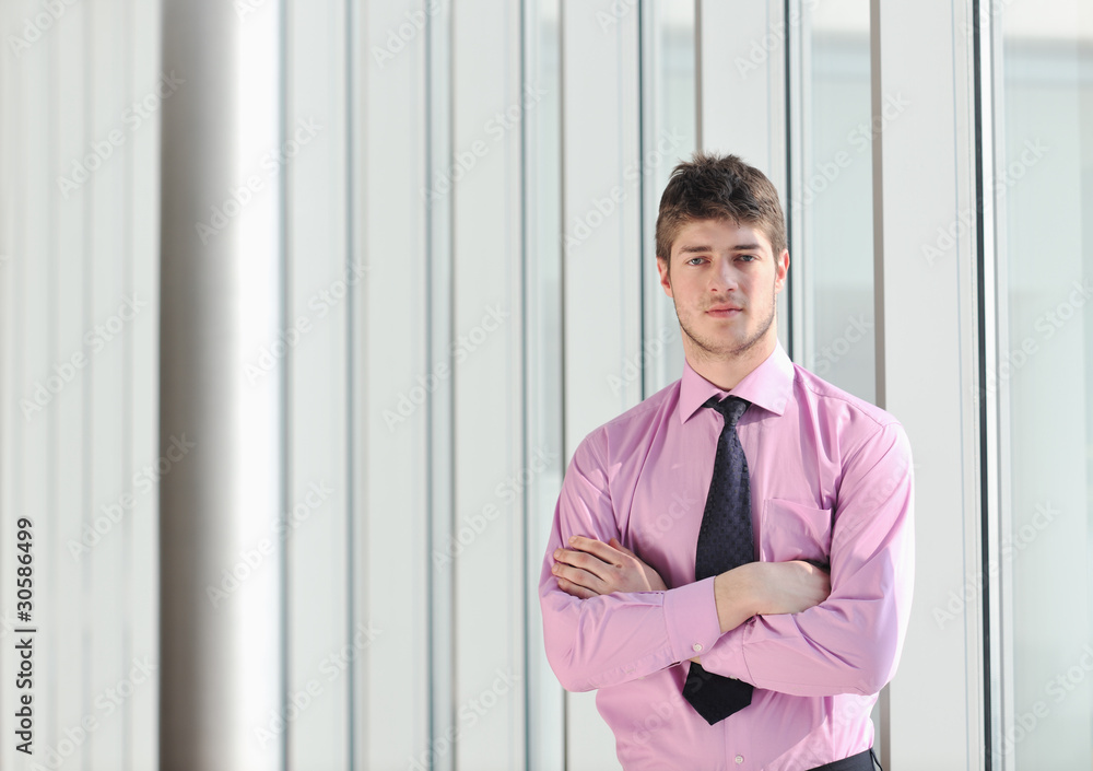 young business man alone in conference room young business man alone in conference room