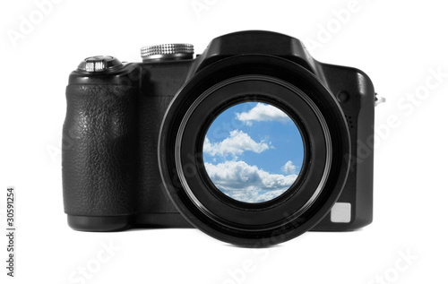 Camera with a beautiful sky in the lens isolated on white