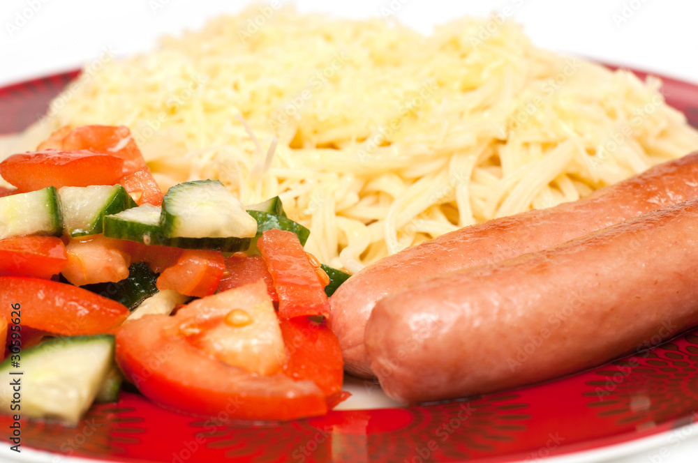 Spaghetti and sausages on white Spaghetti and sausages on white