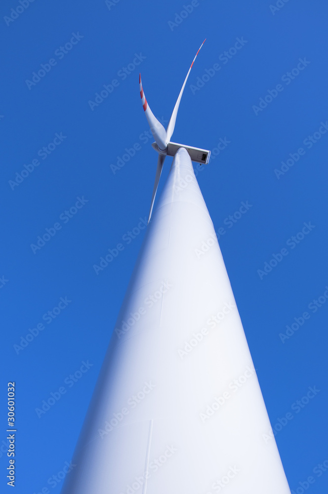 Wind turbine against blue sky Wind turbine against blue sky