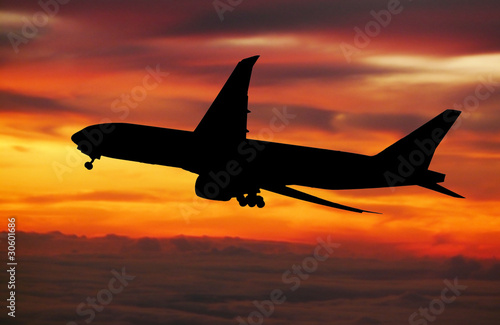 big plane landing at dawn