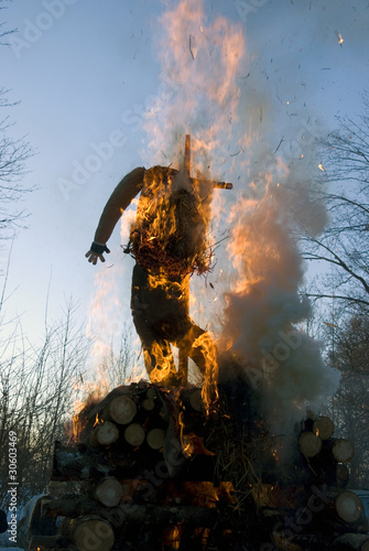 Mardi gras winter effigy in spring fire photo