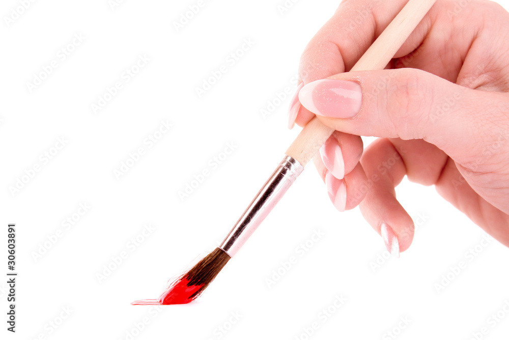 Paint brush in hand isolated on white Paint brush in hand isolated on white