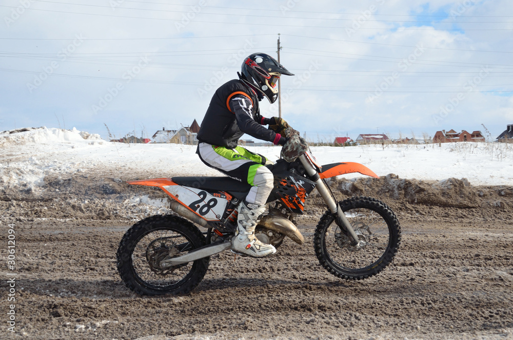 Russia, Samara March 6,2011, motocross rider accelerated Russia, Samara March 6,2011, motocross rider accelerated