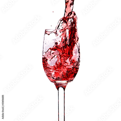 splash red wine in a glass. Closeup. Isolated on white backgroun