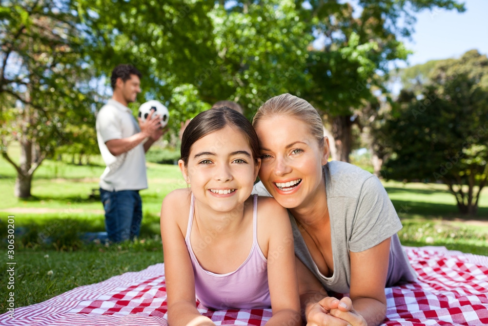 Mother and daughter having fun in the park Mother and daughter having fun in the park