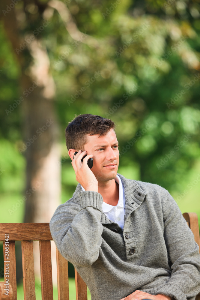 Man phoning on the bench Man phoning on the bench