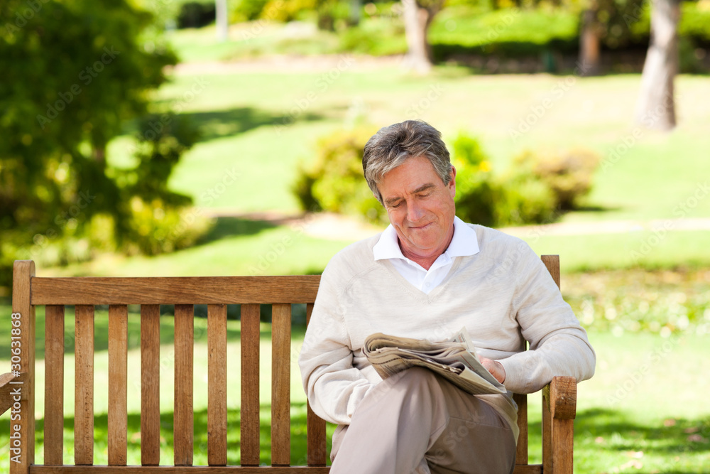 Fototapeta premium Man reading a newspaper