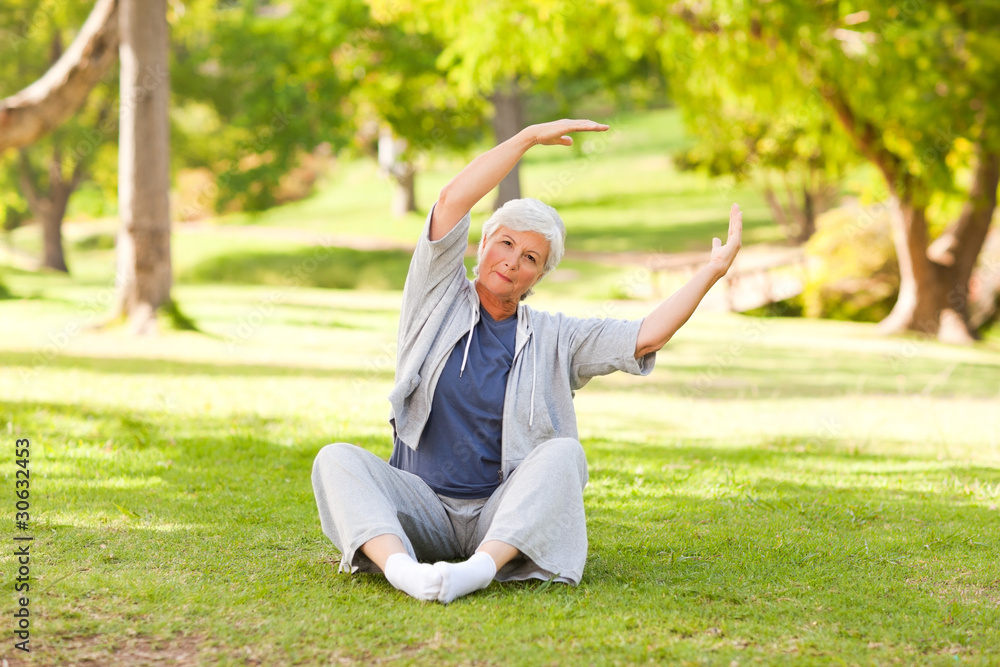 Senior woman doing her stretches in the park Senior woman doing her stretches in the park