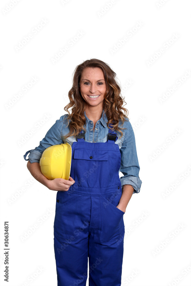 Woman with yellow security helmet standing on white background Woman with yellow security helmet standing on white background